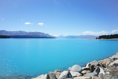 Natural turquoise Lake Tekapo, travel destination, under blue skyの写真素材