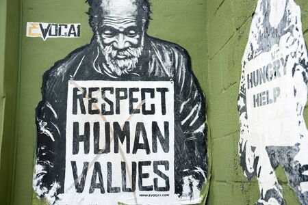 Miami, Florida, USA - June 28, 2012: Respect human values street art  image of destitute man with sign pleading for respect for the needy in Wynwood, Miami.のeditorial素材