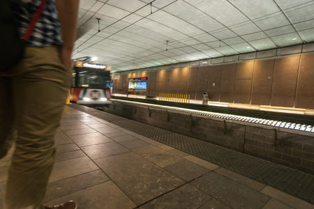 St Louis, Missouri, USA subway rail station with illuminated sign directing to Gateway Arch exit.