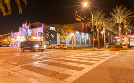 California, USA - October 3, 2015: Pedestrian crossing from car park on West 4th St building to...
