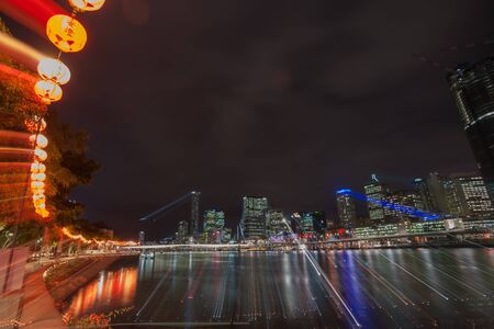 Brisbane, Australia- April 27, 2017; Brisbane South Bank Chinese Lanterns strung along river boardwalk during Chinese Buddha Birth Day Festival at night  in zoom blur abstractのeditorial素材