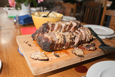 Roast beef on cutting board sliced and ready to eat.の写真素材