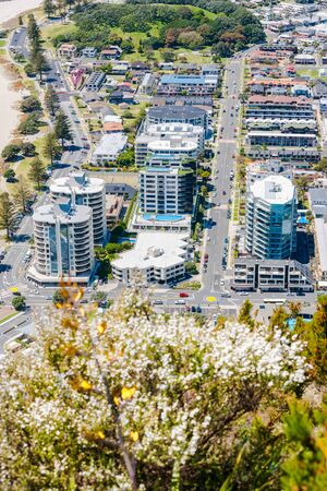 Mount Maunganui from mountain summit resort area with apartment buildings dominating the landscape close to base of mountainのeditorial素材