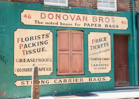 London, England - August 2, 2103; Faded original style signwritten wall Donovan Bros business marketing their products at 46 Gun Street, Spitalfields, Londonのeditorial素材