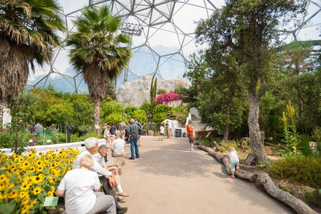 Cornwall, England - July 24, 2013: Eden Project visitors  observing the plants displays or seated resting up inside one of gaint domes Mediterranean Biome featuring plants from that regionのeditorial素材