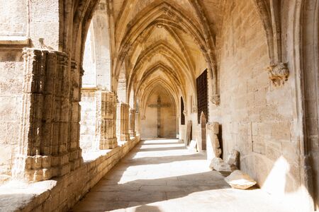 Arched cloister of historic Gothic architectural Cathedral Saint Nazaire, Beziers Franceの写真素材