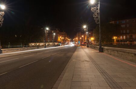 Toulouse, France - October 27, 2016; City lights across Pont Neuf beautifully illuminated on dark night over Garrone River, Toulouse, France.のeditorial素材