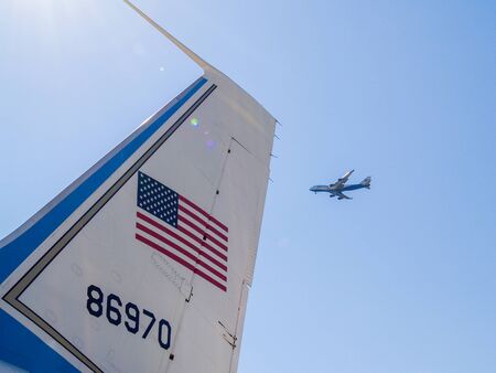 Seattle, USA - July 21, 2008; Tail, US flag and number of Airforce One airplane with passenger plane flying past at Museum of Flight Seattle.のeditorial素材