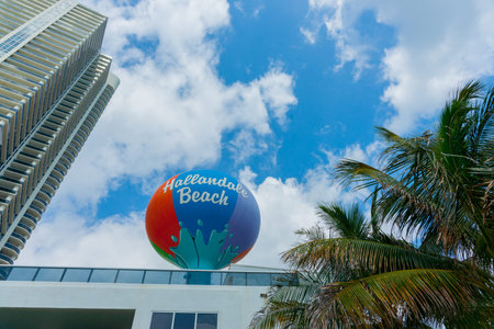Miami USA - June 28, 2012; Hallandale Beach Miami large circular retro colored sign on tall pole...