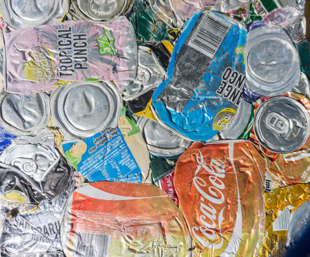 Alofi, Niue - May 29, 2017; Compressed aluminium drink cans with branding showing ready for recycling.のeditorial素材