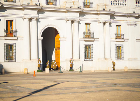 La Moneda presidential palace with uniformed guards on duty around entrance of beautiful...