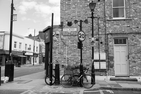 LONDON, ENGLAND - AUGUST 5, 2017; Typical  East London neighborhood interestion and local shops, Lyal Road corner, brick building and street sign.のeditorial素材