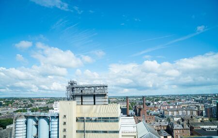 Dublin urban area stretching to distant horizon under blue sky with white clouds.の写真素材
