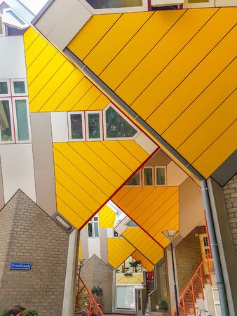 ROTTERDAM, HOLLAND - AUGUST 21, 2017; Cube houses are a set of bright yellow angled cube adjoining innovative architecturally styled apartments built in Rotterdamのeditorial素材