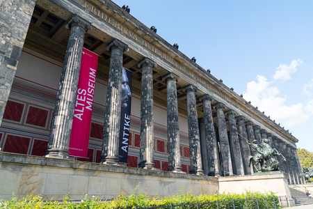 BERLIN, GERMANY - AUGUST 28, 2017; Exterior colonade of historic Altes Mueum on Musium Island in middle of city with statues of Lion Fighter on horseback by Albert Wolff guarding the entrance steps.のeditorial素材