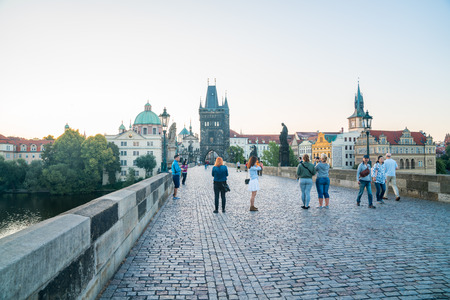 PRAGUE CZECH REPUBLIC - AUGUST 29,2017;  Charles Bridge before sunrise uncrowded people stand for photos and walk across as sun risesのeditorial素材
