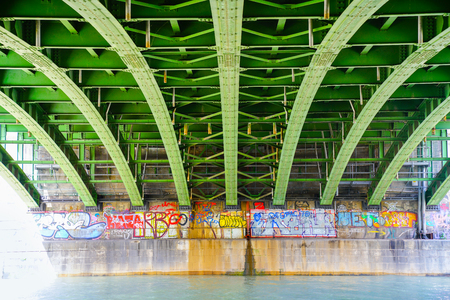 VIENNA,AUSTRIA - SEPTEMBER 4 2017; Graffiti vandalism on walls constructed along embankment of River Danube.のeditorial素材