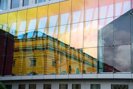 Contrasting architectural styles in reflection creating abstract background