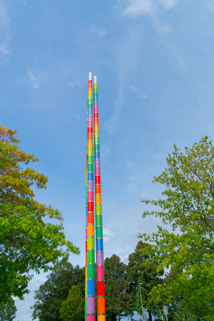 STUTTGART, GERMANY - SEPTEMBER 13 2017; Bright multi-colored totem pole artistic structure in grounds of Mercedes Museum of history of automobile manufacturer in the city.のeditorial素材