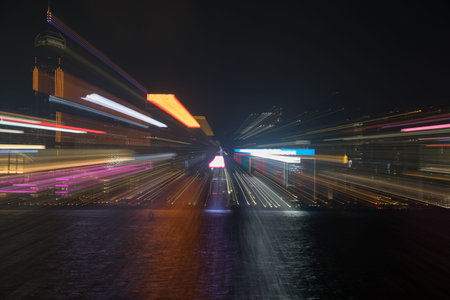 Hong Kong's Victoria Harbor and commericial building on Hong Kong Island illuminated in an abstract...