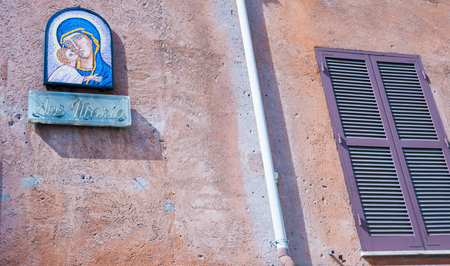 ROME, ITALY - APRIL 16 2011; Mosaic of Virgin Mary and child Jesus plaque with sign below reading Ave Maria on exterior wall on street in Rome.のeditorial素材