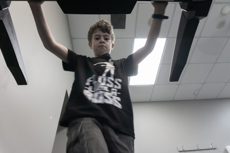 TAURANGA NEW ZEALAND - DECEMBER 15,2018; Young person engaged in physical activity at a gym walking...