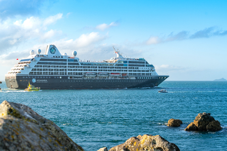 TAURANGA NEW ZEALAND - JANUARY 24 2019; Cruise ship Azamara Quest leaves the hatbour and head out to sea accompanied by pilot and tug boats.のeditorial素材