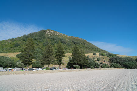 MOUNT MAUNGANUI NEW ZEALAND - FEBRUARY 8 2019: Sand grooming patterns on Mount Main Beach in front of Mount Camp and under landmark mountain,のeditorial素材