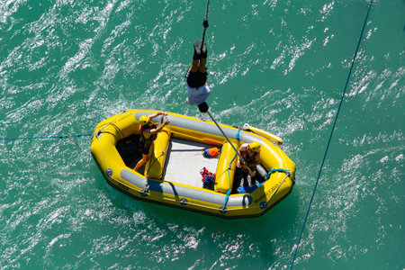 QUEENSTOWN NEW ZEALAND - OCTOBER 21 2018; After jumping being pulled into waiting inflatable at AJ...