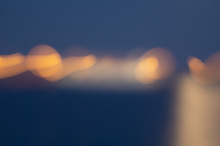 Golden light shining over water defocued in abstract background conceptualの写真素材