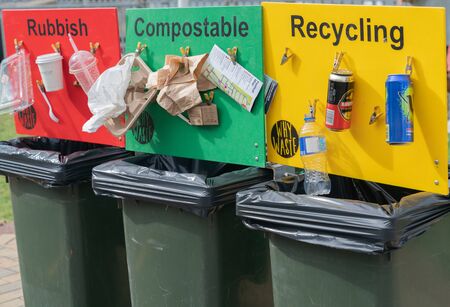TAURANGA NEW ZEALAND - APRIL 21 2019; Colored public recycling signs with examples attached to waste binsのeditorial素材