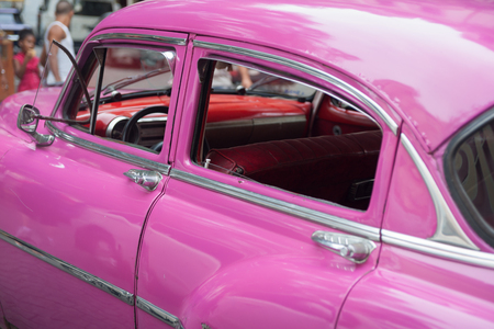 Bright pink American classic car close-up in Havana Cuba.の写真素材
