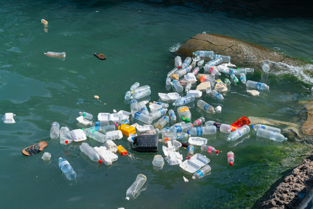 KOTA KINABALU BORNEO -JUNE 1 2019; Sea polution, plastic trash disposed of in harbor.