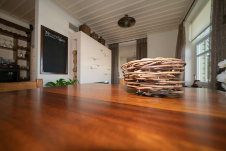 Mourayio stylish dining area and wooden table top with decoration in comfortable Bed and Breakfast,...