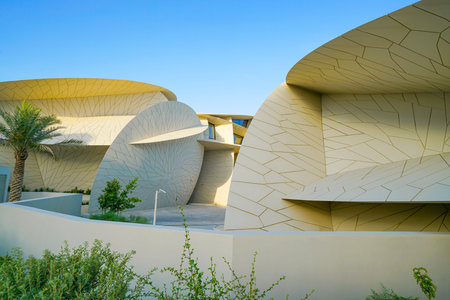 DOHA QATAR - JULY 10 2019; National Museum of Qatar unusual but striking design form is inspired by...