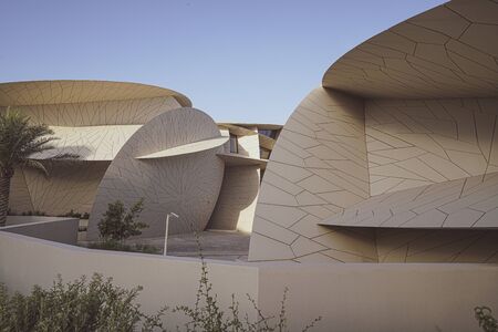DOHA QATAR - JULY 10 2019;National Museum of Qatar unusual but striking design form is inspired by desert rose crystal opened in March 2019  designed by architect Jean Nouvel.のeditorial素材