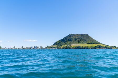 Mount Maunganui landmark and beach with apartment buildings in Tauranga New Zealand.の写真素材