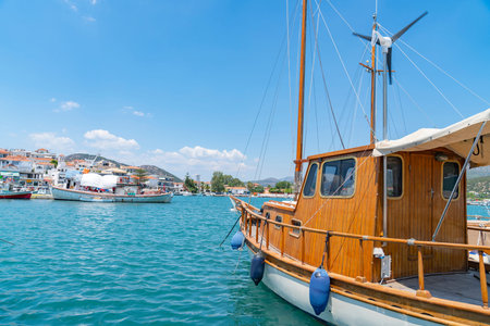 Ermioni waterfront with its quaint fishing boats moored along pier.