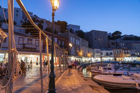 Hydra, Greek Island - July 20 2019; Town and waterfront at night as tourists move about enjoying life and the atmosphere on Greek islandのeditorial素材