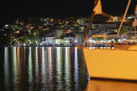 Night lights around bay along Akti Mitseon at Ermioni from in front of Mourayio Hotel.の写真素材