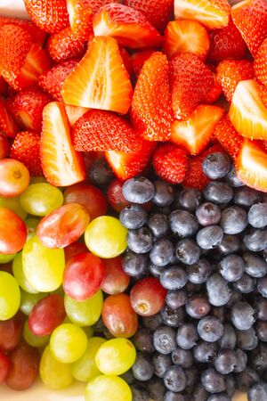 Selection prepared breakfast fruits and berries togeher in colorful presentation.の写真素材