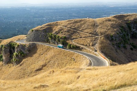 Hastings New Zealand - February 16 2020; Blue and white VW Kombi descends Te Mata Peak in Hawkes...
