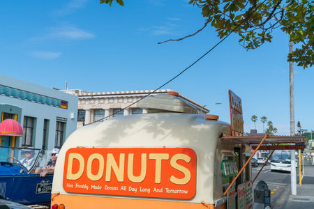Napier - New Zealand - February 16 2020; Donuts food cart opens in Napier street with large orange...