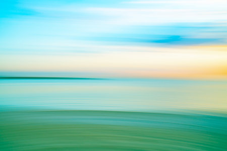 Beach abstract in soft hues and horizontal patterns at St Kilda Beach back-lit by setting sun,...
