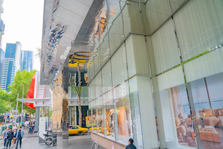 Melbourne, Australia - March 9 2020; Street scene with modern window display and reflections in...