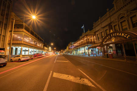 Ballarat Australia - March 15 2020; Wide angle stree view of Mair Street at night  with Mining Exchange building among other Victorian buildings under street light in historic townのeditorial素材