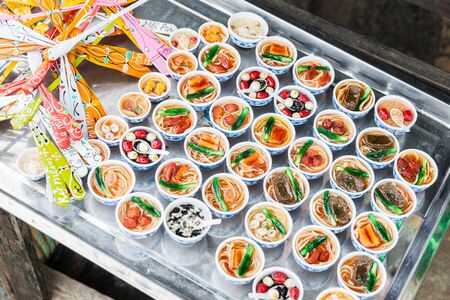 Asian small dish selection of tasty food arranged an a tray.の写真素材