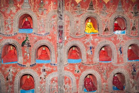 The Temple wall contains hundreds of Buddha statue's in alcove's the wall in Pagoda of Nyan Shwe Kgua temple near Inle lake,Shan state in Myanmar.の写真素材
