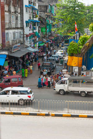 Yangon Myanmar - October 26 2013;  Typically Asian city street in Burma in vertcial composition.のeditorial素材