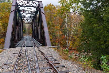 Steel truss railway bridge across Sawyer River at Bears Notch on Kancamagus Highway, New Hampsire USA.の写真素材